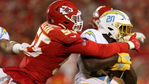 Frank Clark #55 of the Kansas City Chiefs tackles Sony Michel #20 of the Los Angeles Chargers during the fourth quarter at Arrowhead Stadium on September 15, 2022 in Kansas City, Missouri (Getty Images)